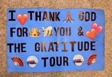 a sign that says i thank a god for you and the gratitude tour