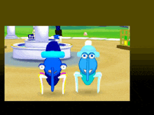 a couple of blue cartoon characters standing next to each other