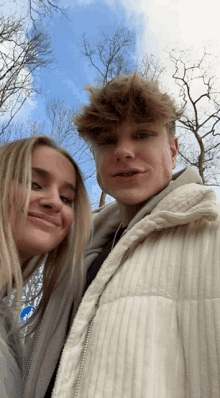 a man and a woman are posing for a picture together