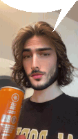 a man with long hair and a beard is holding an orange can that says ' juice ' on it