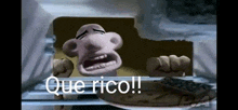 a cartoon character is looking out of a refrigerator with the words que rico written on it .