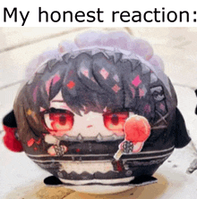 a stuffed toy of a girl with red eyes is sitting on a table with a lollipop in her hand .