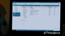 a dell computer monitor displays a list of emails and the words @tvresidence below it