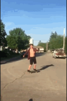 a man is riding a skateboard down a street