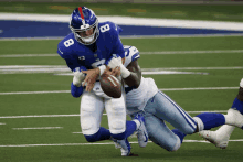 a new york giants player with the number 8 on his helmet