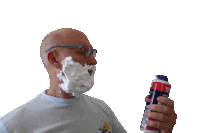 a man with foam on his face is holding a can of foam