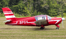 a small red and white plane with the letters f-bpgv on the side