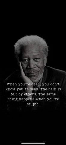 a black and white photo of a man with a beard and a quote from morgan freeman .