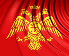 a red curtain with a yellow eagle and the letter k in the center