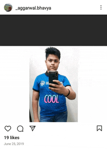 a boy is taking a picture of himself with a shirt that says cool