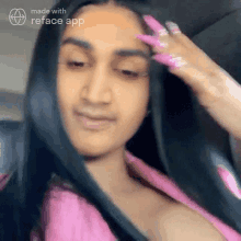 a woman with long black hair and pink nails is being made with reface app