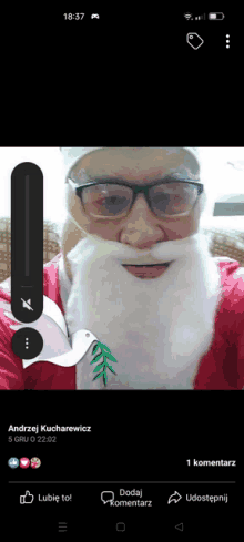 a man with glasses and a beard is dressed as santa