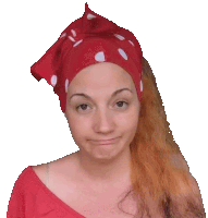 a woman wearing a red head scarf with white polka dots