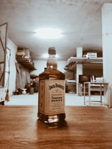 a bottle of jack daniel 's whiskey sits on a table