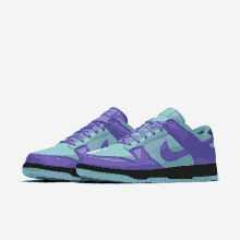 a pair of purple and blue nike sneakers