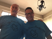 two men wearing blue t-shirts that say the karma bundles