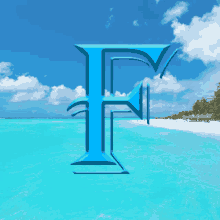 a blue letter f is on a beach with palm trees