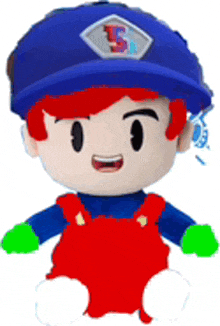 a stuffed toy with red hair and green gloves is wearing a blue hat and overalls .