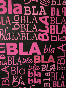 a chalkboard with the word bla written in pink