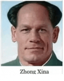 a close up of a man 's face with the name zhong xina written on it .