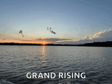 a picture of a lake with the words grand rising written below it