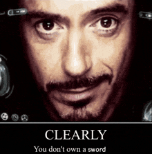 a poster of tony stark with the words clearly you don 't own a sword