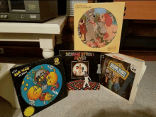 sesame street fever sits on a table next to other albums