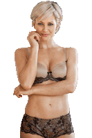 a woman wearing a bra and panties is smiling with her hand on her chin