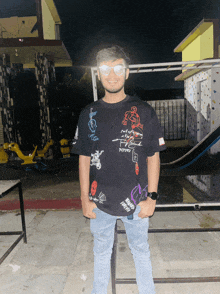 a man wearing a black t-shirt that says " nothing to fear "