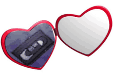 a heart shaped mirror shows a vhs tape