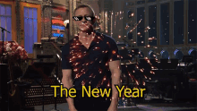 a man wearing sunglasses says the new year