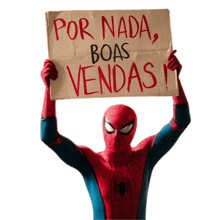 a man in a spider man costume holds up a sign that says por nada boas vendas