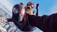 a man in a spiderman costume is flying through the air with a cat .