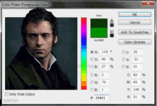 a computer screen shows a man 's face and a color picker window