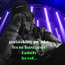 a person wearing a black jacket and a black hat with the words patasking po ako from bastard family bossg