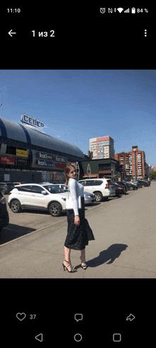 a woman stands in front of a building with the word iceberg on it