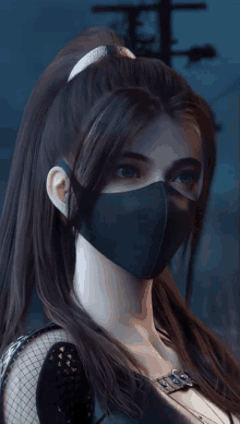 a woman wearing a black mask with a ponytail