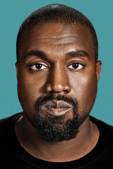 a close up of a man 's face with a beard on a blue background