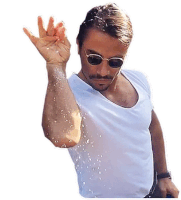 a man wearing sunglasses and a white shirt is holding his hand up in the air .