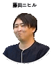 a pixelated image of a man in a black shirt with chinese writing on it .