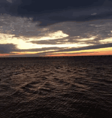 a large body of water with a bridge in the distance