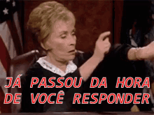 a woman is sitting at a table with the words " ja passou da hora de voce responder "