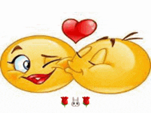 two smiley faces are kissing each other with a red heart between them .