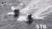 a black and white photo of two boats in the ocean with st6 written in white