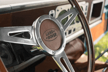 a land rover steering wheel with a wooden steering wheel