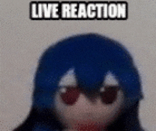 a stuffed animal with blue hair and red eyes is wearing sunglasses and has the words `` live reaction '' above it .