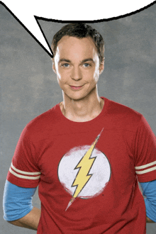 a man wearing a red shirt with a lightning bolt on the front