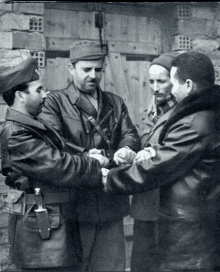 a black and white photo of a group of soldiers