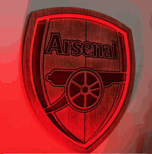 a wooden shield with the word arsenal written on it