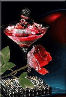 a picture of a martini glass with a red rose and the words mani dj on the bottom